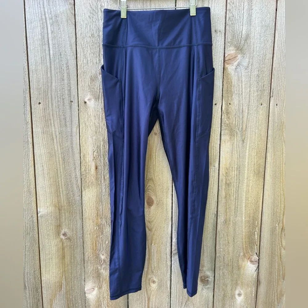 Fabletics Navy Oasis Shine High Waisted Pocket 7/8 Legging - Picture 5 of 9